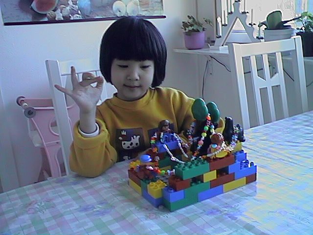 Ria is playing lego